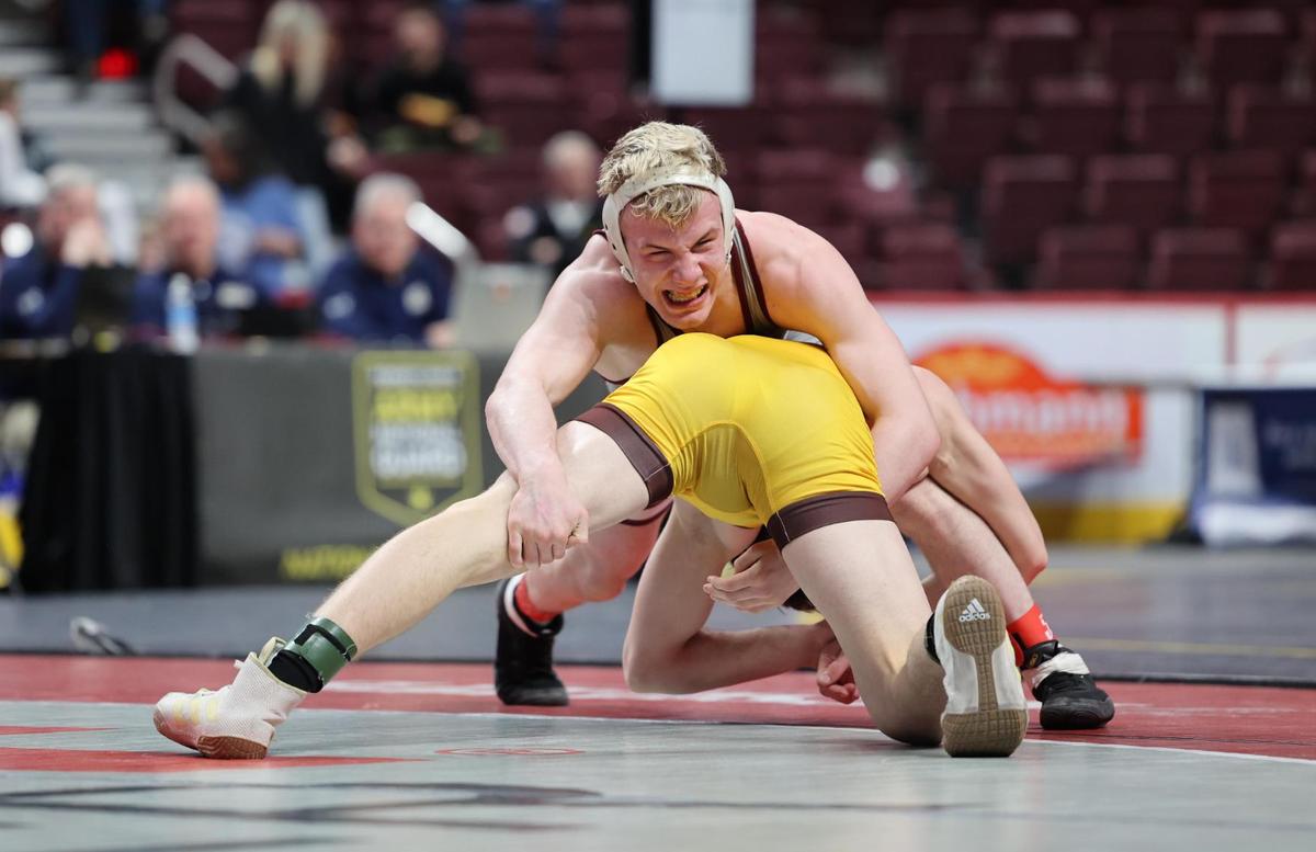 State College’s Pierson Manville tries to fight off a takedown attempt from Bethlehem Catholic’s Kollin Rath in their 139-pound finals match of the PIAA Class 3A Championships on Saturday, March 11, 2023 at the Giant Center in Hershey. Rath edged Manville, 4-2.