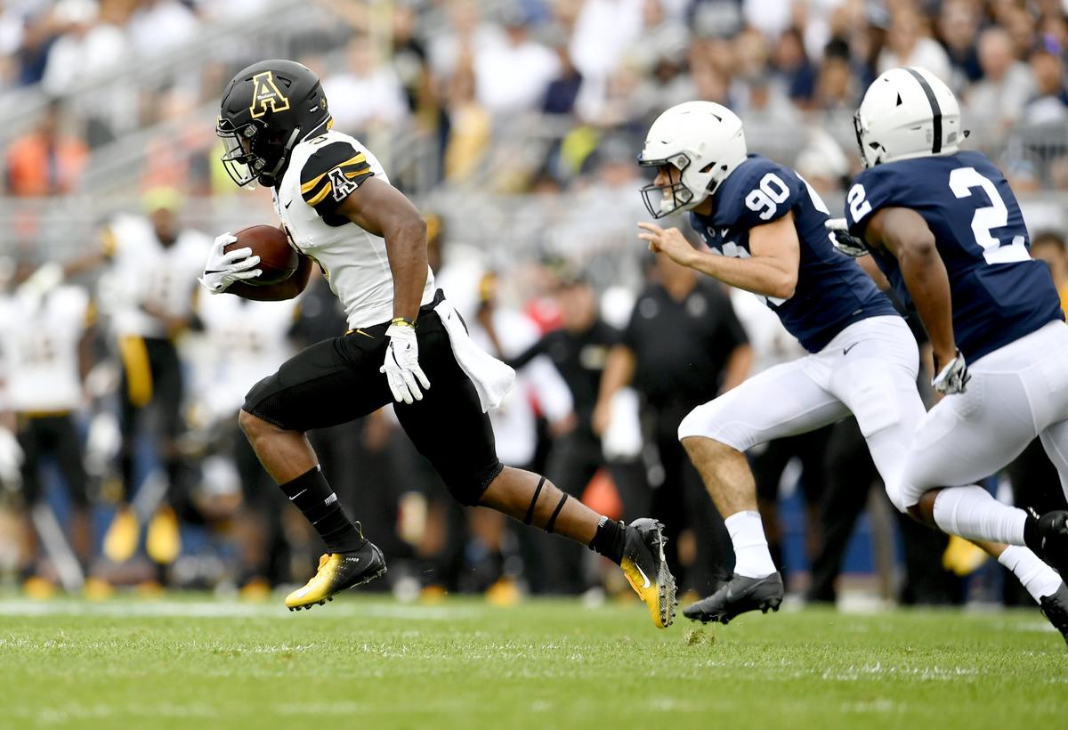 Appalachian State’s Darrynton Evans returns a kickoff for a touchdown during the first quarter of the game Saturday, Sept. 1, 2018 at Beaver Stadium.