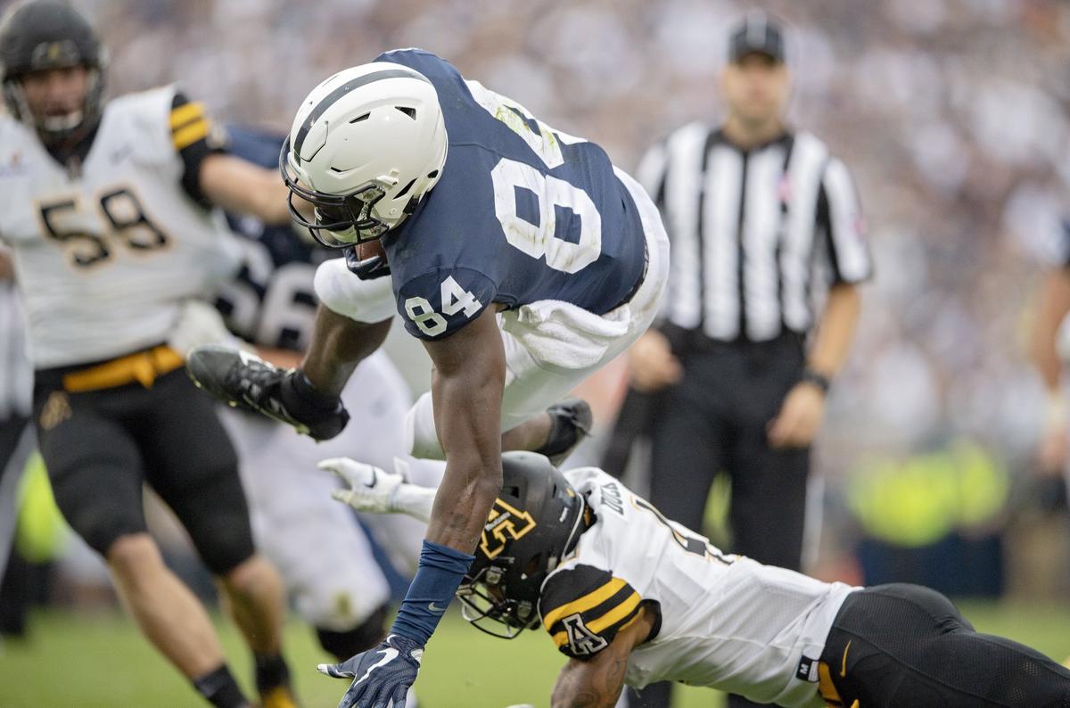 Appalachian State defensive back Clifton Duck trips up Penn State wide receiver Juwan Johnson after he makes a catch during the Saturday, Sept. 1, 2018 game at Beaver Stadium.