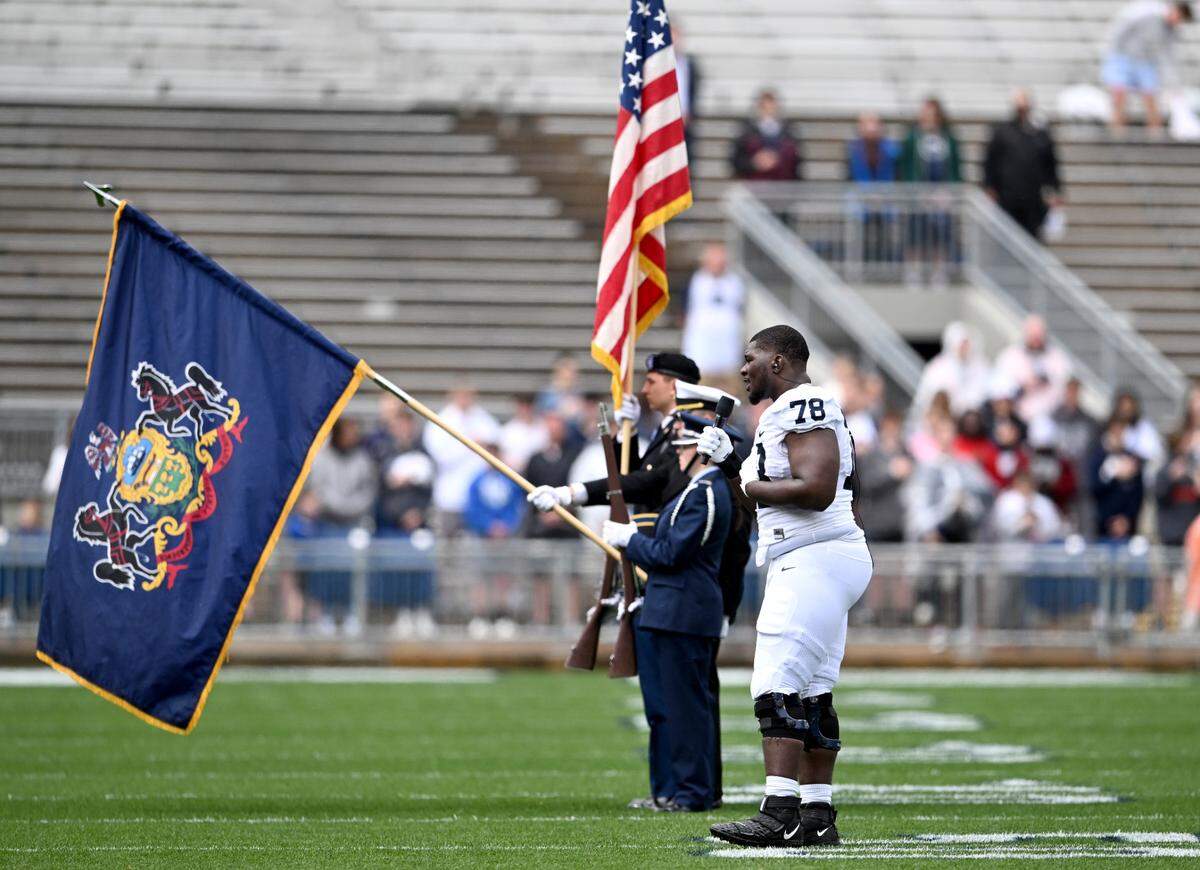 Penn State offensive lineman Golden Israel-Achumba sings the national anthem for the Penn State Blue-White game on Saturday, April 15, 2023.