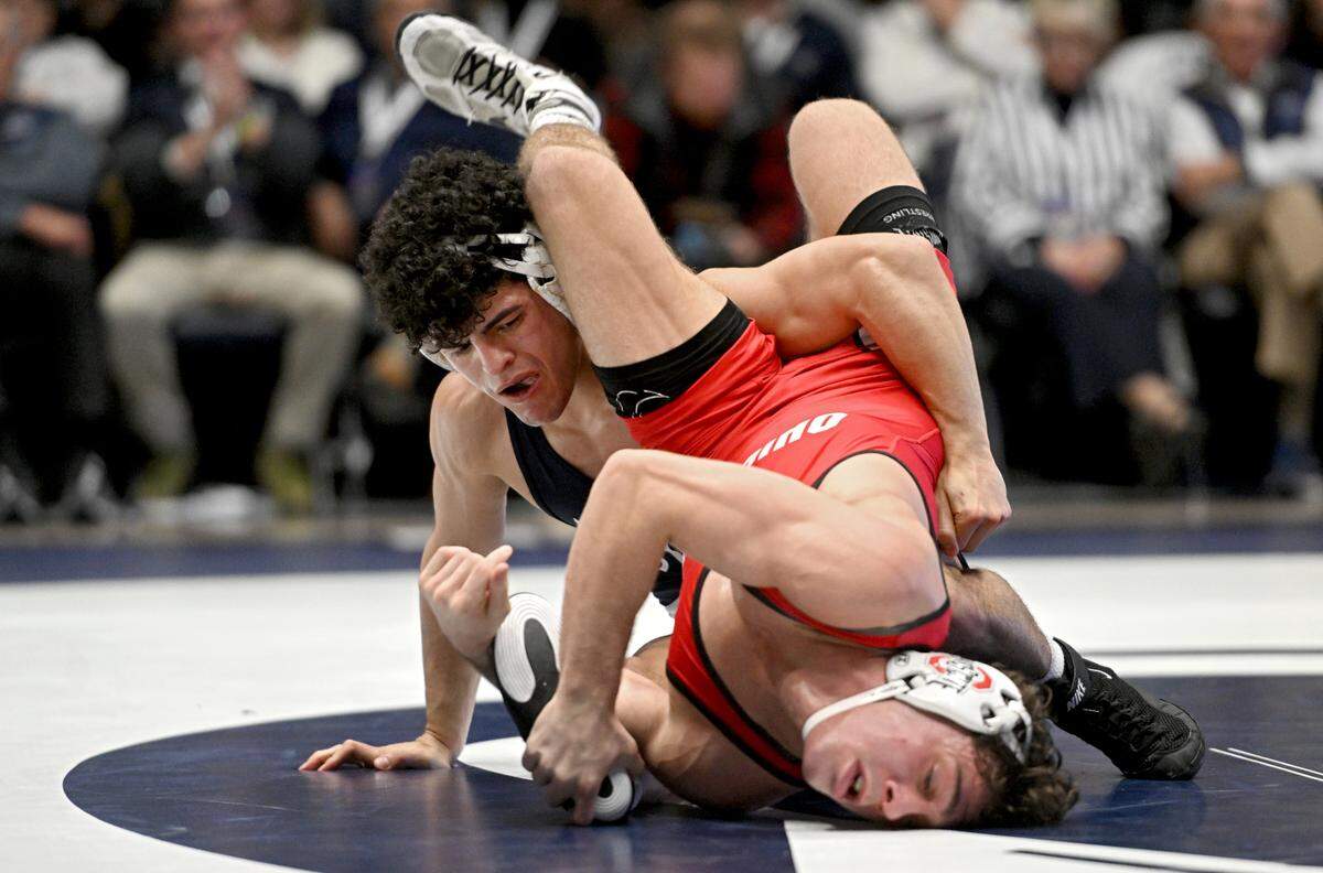 Penn State’s Beau Bartlett controls Ohio State’s Jesse Mendez in overtime of the 141 lb bout during the match on Friday, Feb. 2, 2024 in Rec Hall.