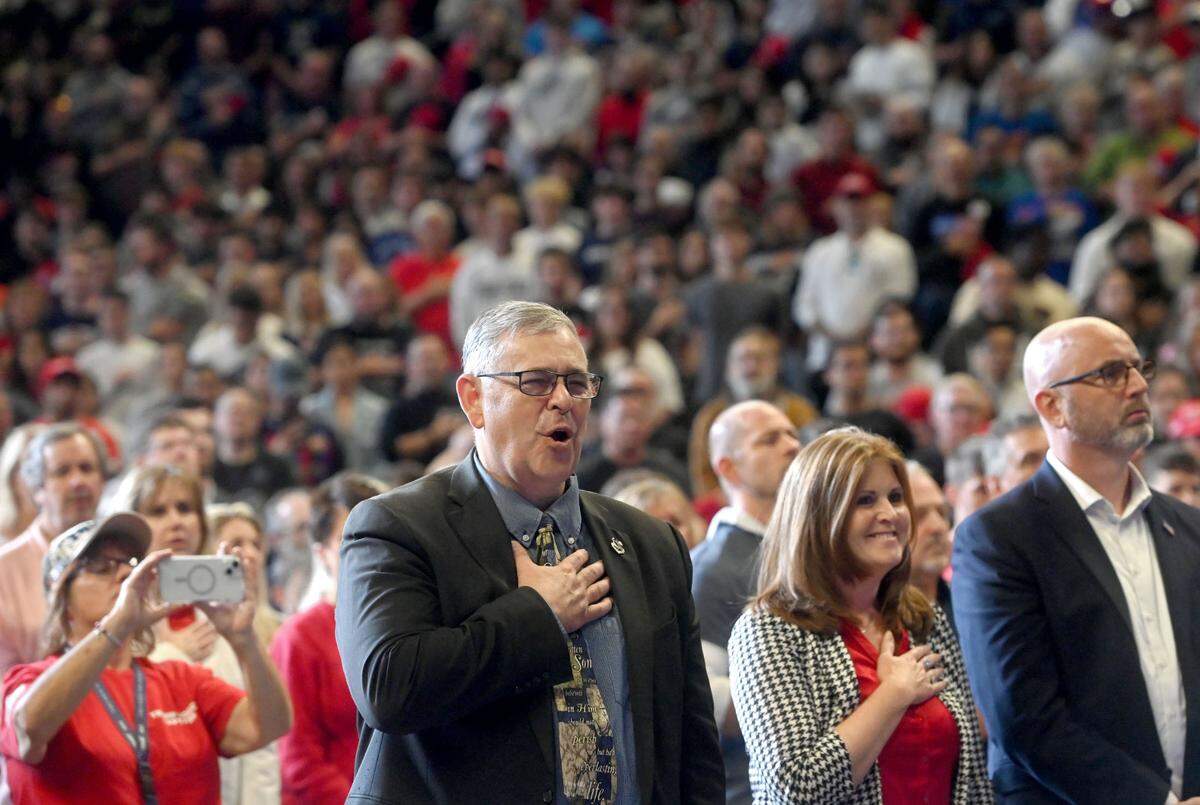 Sen. Cris Dush, R-Brookville sings the national anthem at the Donald Trump rally at the Bryce Jordan Center on Saturday, Oct. 26, 2024.