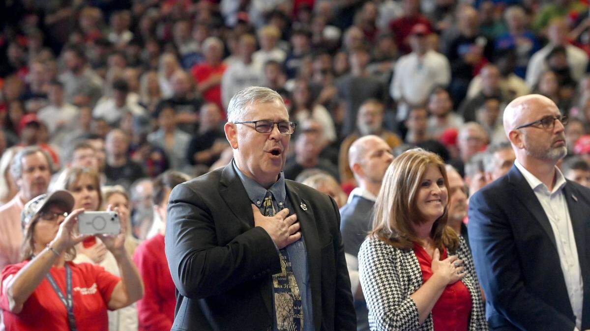 Sen. Cris Dush, R-Brookville sings the national anthem at the Donald Trump rally at the Bryce Jordan Center on Saturday, Oct. 26, 2024.  