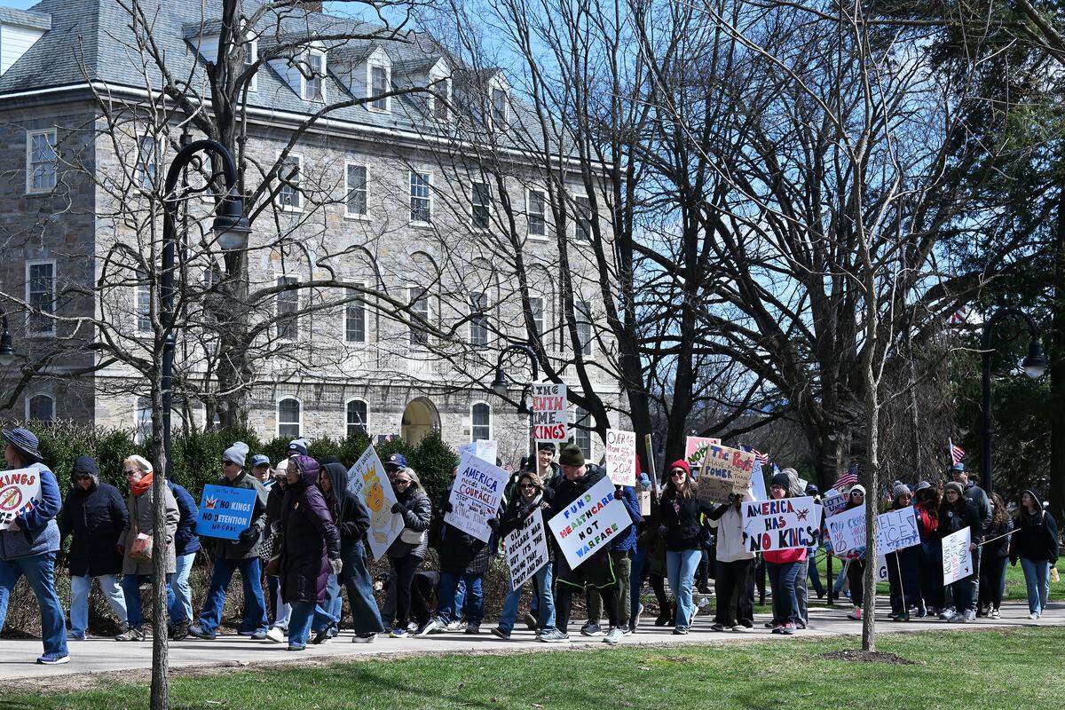 Protesters marched through the Penn State campus as part of the No Kings anti-Trump rally on Saturday.