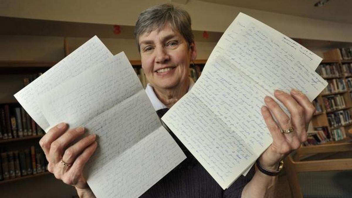 Rachel Rider and some of her parents’ love letters during a recent presentation at Foxdale Village. Below: As a retirement project, Rider published a trove of letters her parents wrote to one another as they fell in love decades ago.
