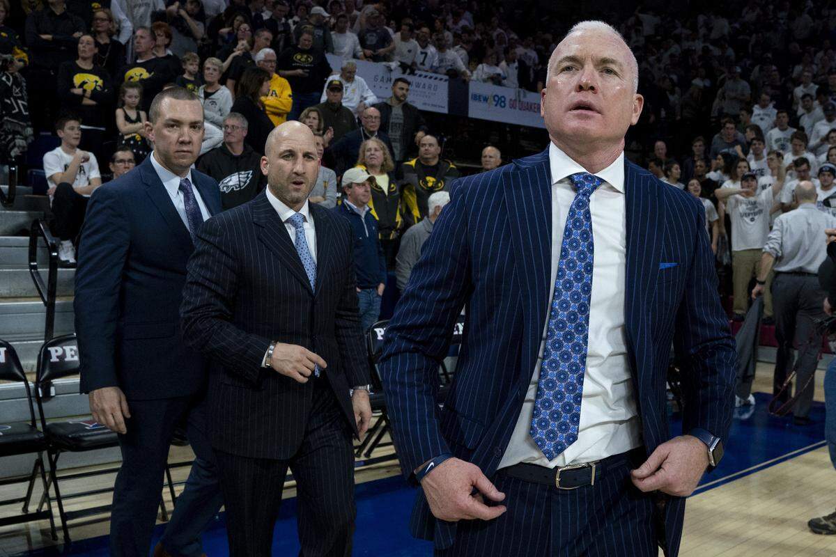 Penn State head coach Patrick Chambers, right, looks on following the second half of an NCAA college basketball game against Iowa Saturday in Philadelphia.
