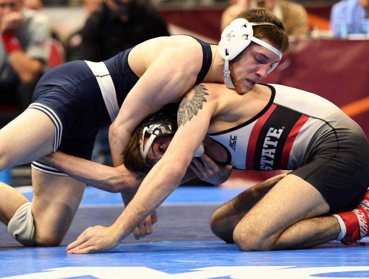 Penn State’s Nick Lee wrestles North Carolina State’s Kevin Jack in the fifth-place match for 141 pounds at the NCAA Division I Wrestling Championships Saturday, March, 17, 2018 at the Quicken Loans Arena in Cleveland, Ohio.