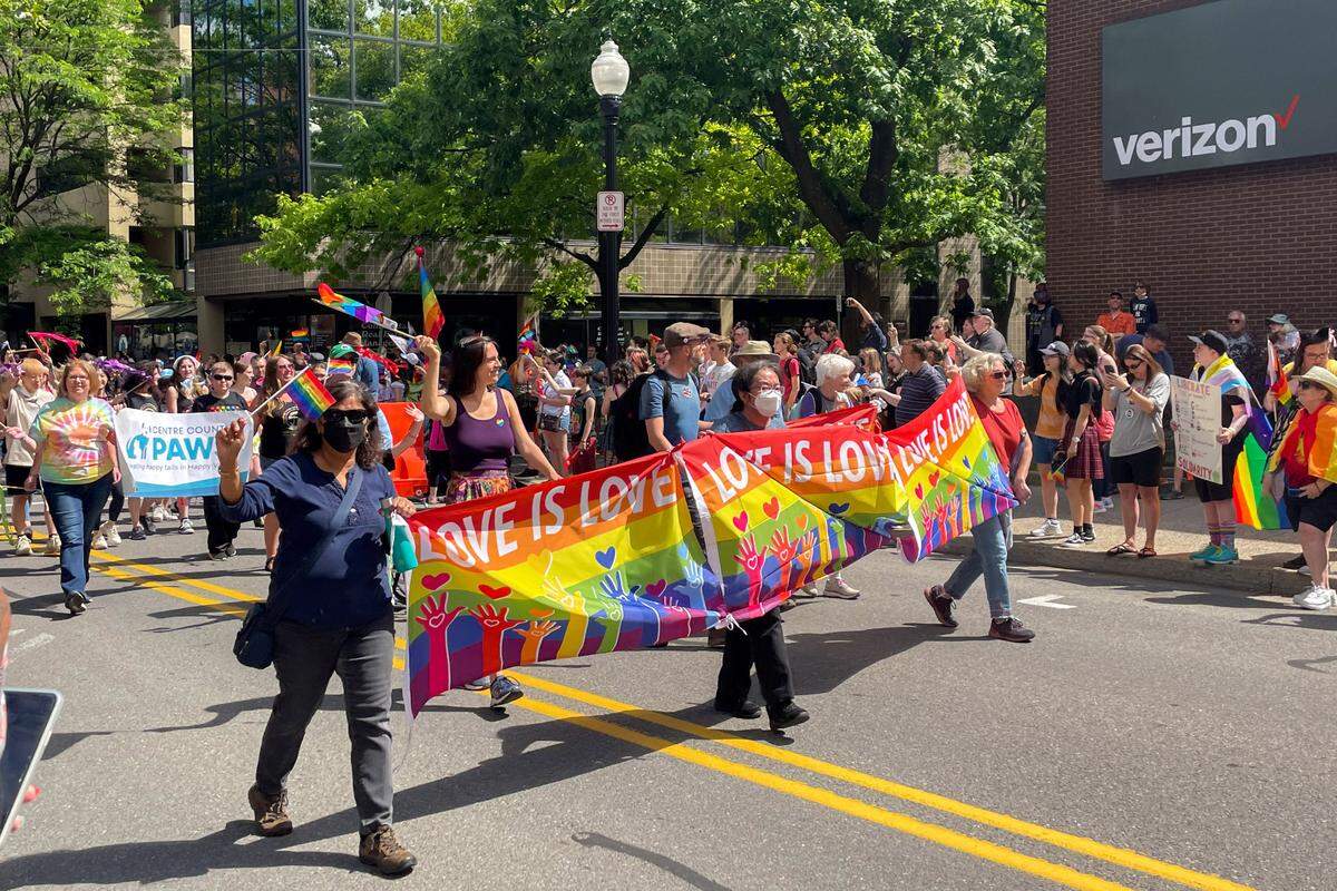 Community members marched and drove down Allen Street as part of State College Pride’s “Pride Ride” parade.