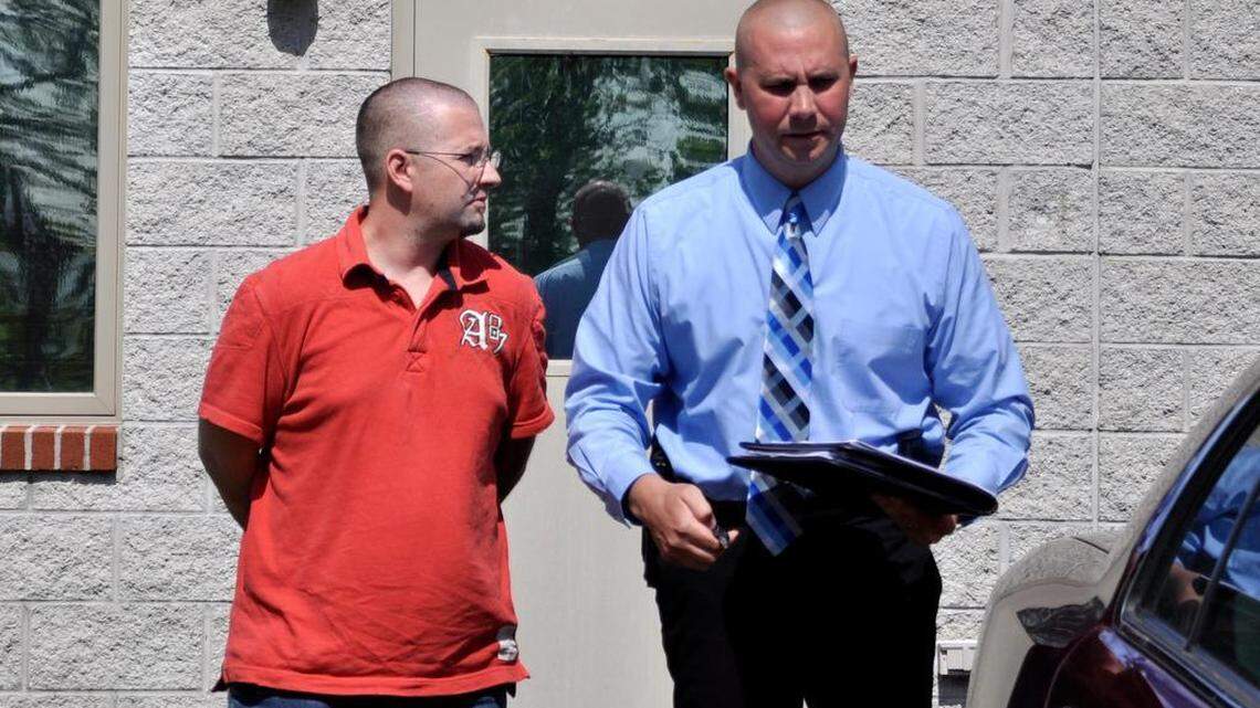 Edward Geier, left, leaves his arraignment on rape charges in front of District Judge Kelley Gillette-Walker on Tuesday.
