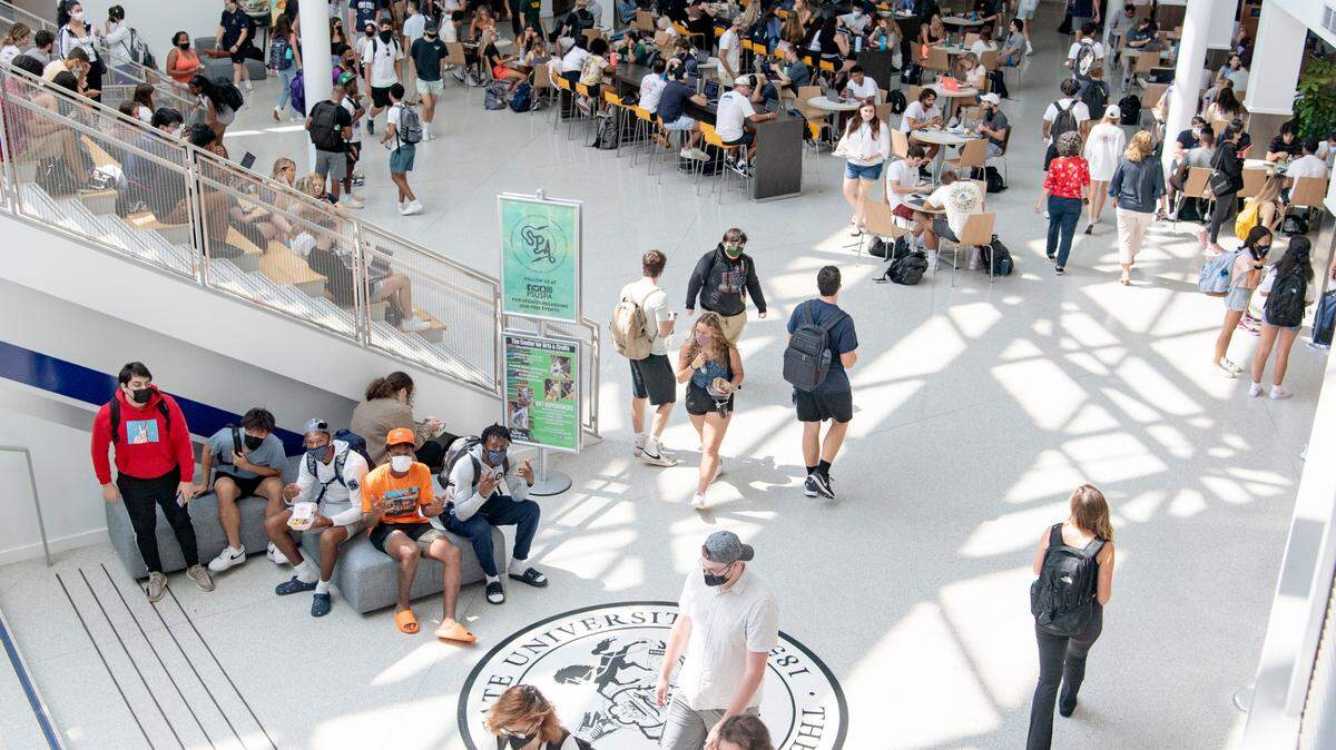 Penn State students gather in the HUB on the first day of classes on Aug. 23. Professors and scientists from Coalition for a Just University recently published a report that offers COVID-19 recommendations for the fall semester.
