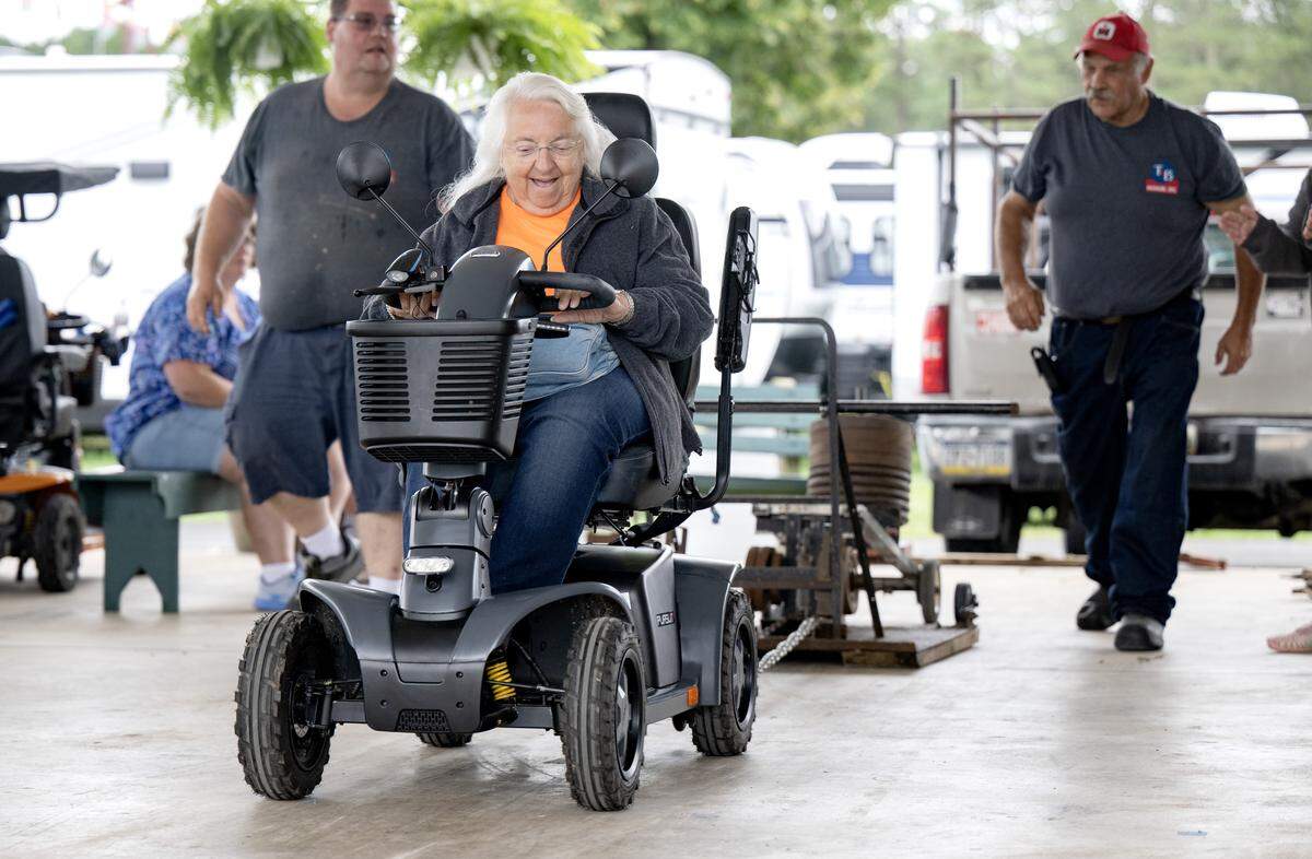 Dianne Crater laughs as she competes in the scooter pull at the Centre County Grange Fair on Thursday, Aug. 21, 2025. The scooter pulls were hosted by T&B Medical with scooters for folks to test out with teh pull.  