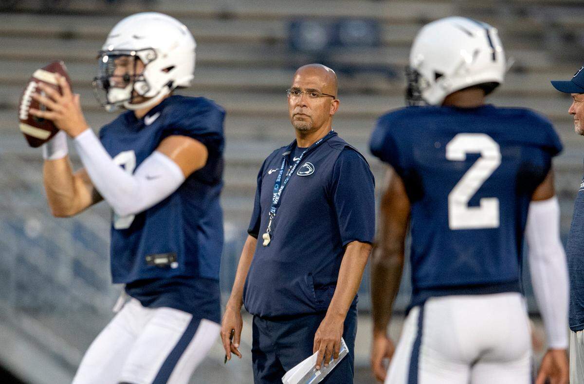 Penn State football coach James Franklin watches quarterbacks Christian Veilleux and Ta’Quan Roberson during practice on Wednesday, Aug. 25, 2021 in Beaver Stadium.
