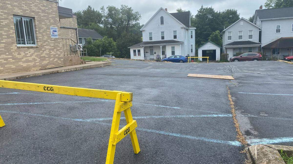 The Centre County sheriff’s department west parking lot is closed after a sinkhole unexpectedly opened up. Although the opening is small, the sinkhole is large beneath the surface.