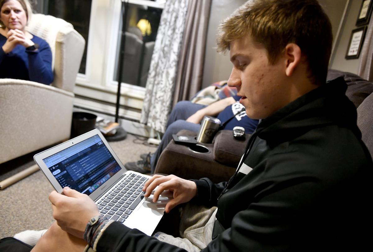 Logan Snyder, a junior at Penns Valley High School, tries to load his school email and assignments from his home in Madisonburg on March 19, 2019. Snyder’s family uses a cellular data hotspot for their internet connection, which leaves doing school work, especially with videos, near impossible.