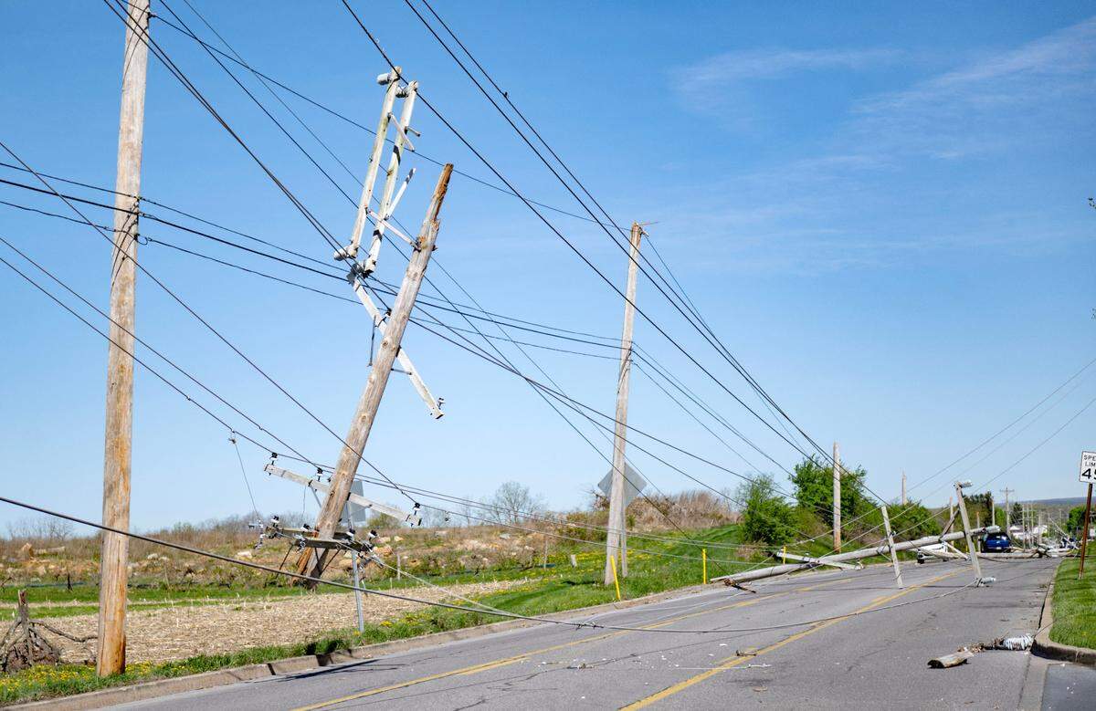 Multiple poles snapped on West College Avenue between Whitehall Road and Bristol Avenue on Wednesday after a severe storm on Tuesday night.
