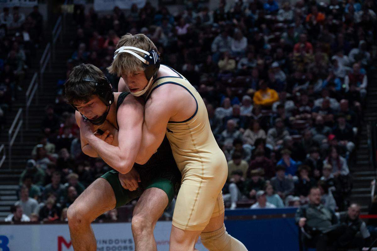 Bald Eagle Area's Tanner Guenot looks for a mat return against Trinity’s Will Detar in the finals of the PIAA Class 2A Wrestling Championships on Saturday, March 7, 2026 in the Giant Center in Hershey, Pa. Detar won by decision.