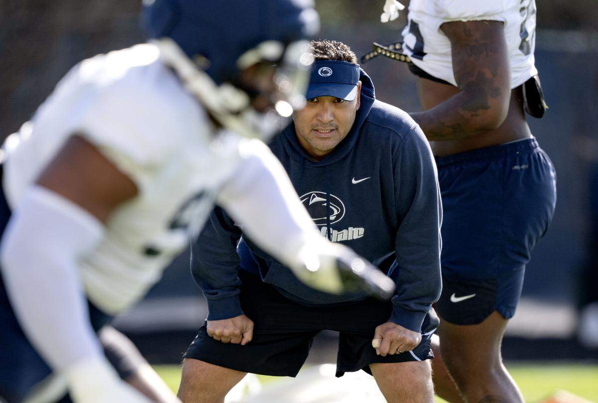 Penn State defensive line coach Ikaika Malloe watches players run a drill during practice on Thursday, April 9, 2026.  