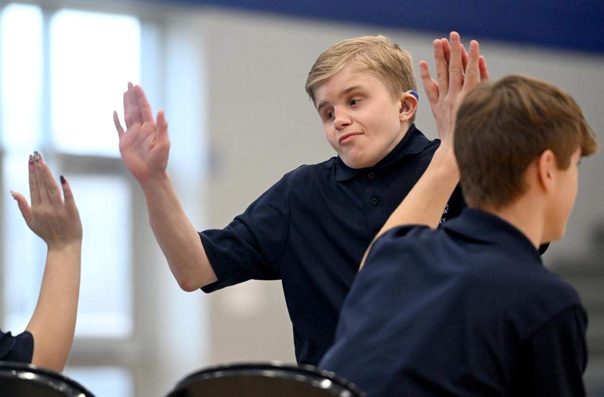 Penns Valley’s Jonathan Heltman high-fives teammates after his roll during the unified bocce match against Philipsburg-Osceola on Thursday, Jan. 30, 2025.