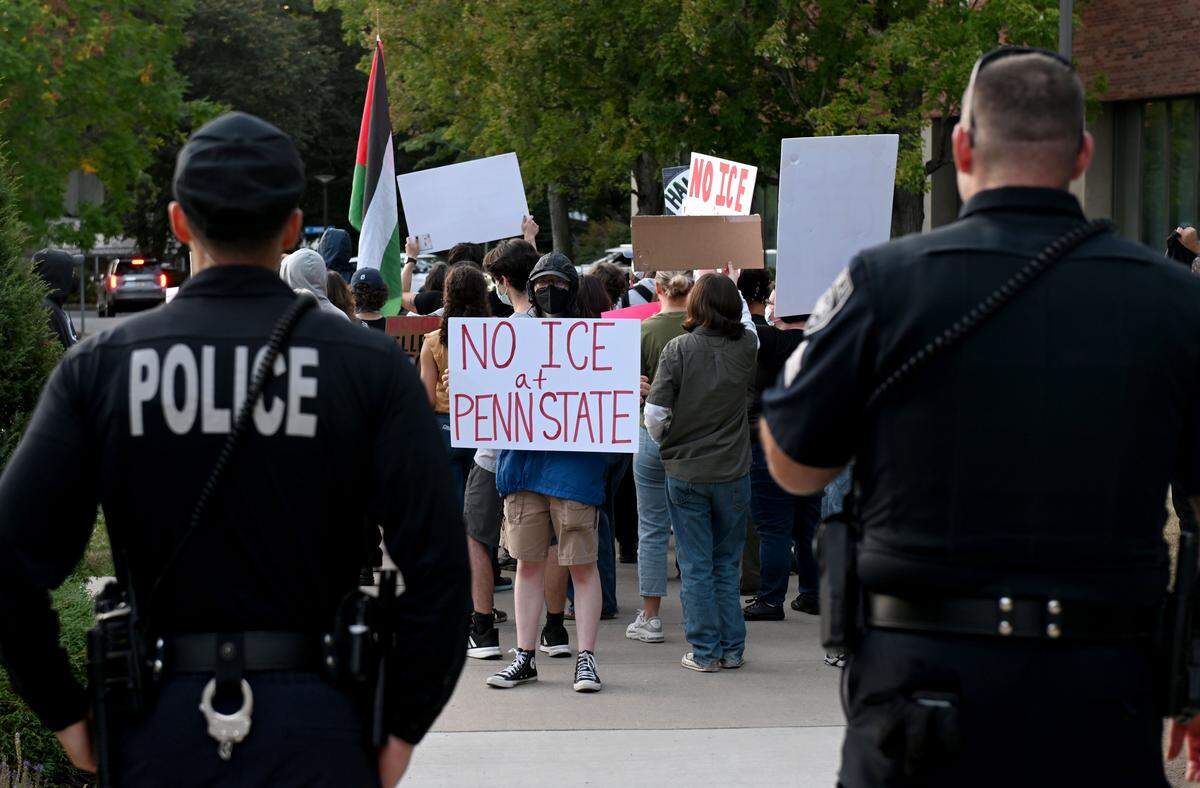 Penn State Police watch an anti-ICE protest that marched from the Allen Street gates to the Nittany Lion Inn on Thursday, Sept. 11, 2025.  