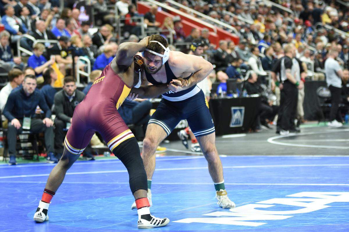 Penn State’s Brady Berge controls Central Michigan’s Johnny Lovett in their 157-pound consolation second round match of the NCAA Championships on Friday, March 18, 2022 at Little Caesars Arena in Detroit. Berge edged Lovett, 4-3.