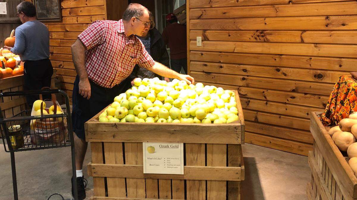 John Cimbala selects apples to purchase at Way Fruit Farm in 2018.