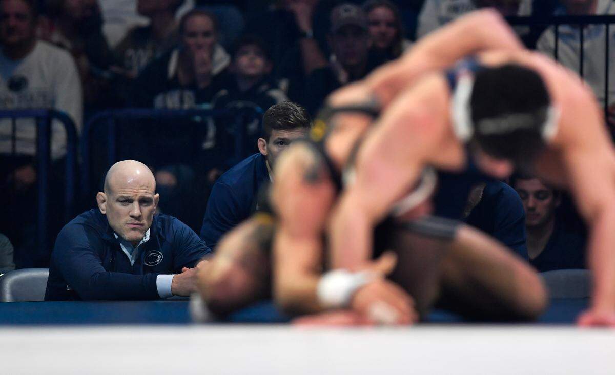 Penn State wrestling coach Cael Sanderson watches Beau Bartlett in his 141 lb bout against Iowa’s Real Woods on Friday, Jan. 27, 2023 at the Bryce Jordan Center.