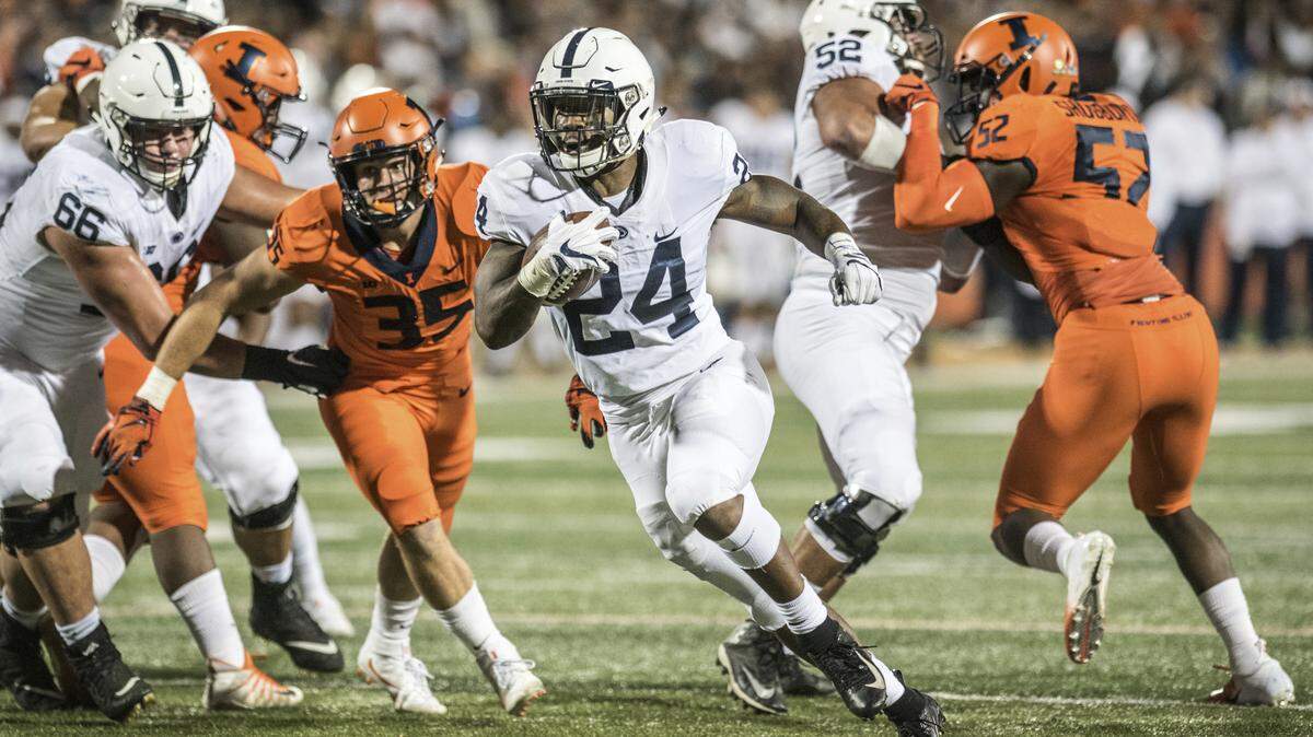 Penn State running back Miles Sanders (24) finds a hole in the first quarter against Illinois during an NCAA college football game Friday, Sept. 21, 2018, in Champaign, Ill. (AP Photo/Holly Hart)