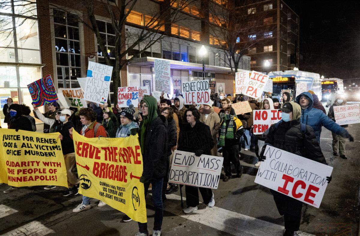 Anti-ICE protesters stop traffic as they march on Beaver Avenue in downtown State College on Monday, Jan. 12, 2026. 