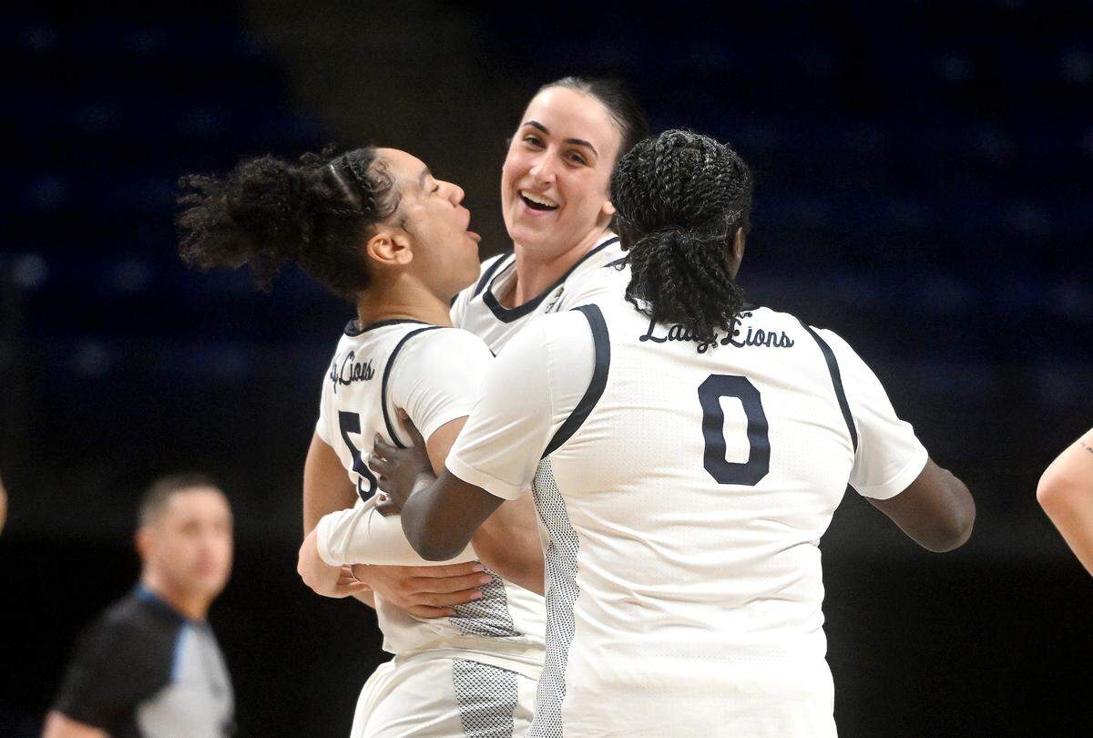 Penn State’s Leilani Kapinus, Ali Brigham and Ashley Owusu celebrate a basket in overtime of the game against George Mason in the first round game of the Women’s Basketball Invitational Tournament on Thursday, March 21, 2024.