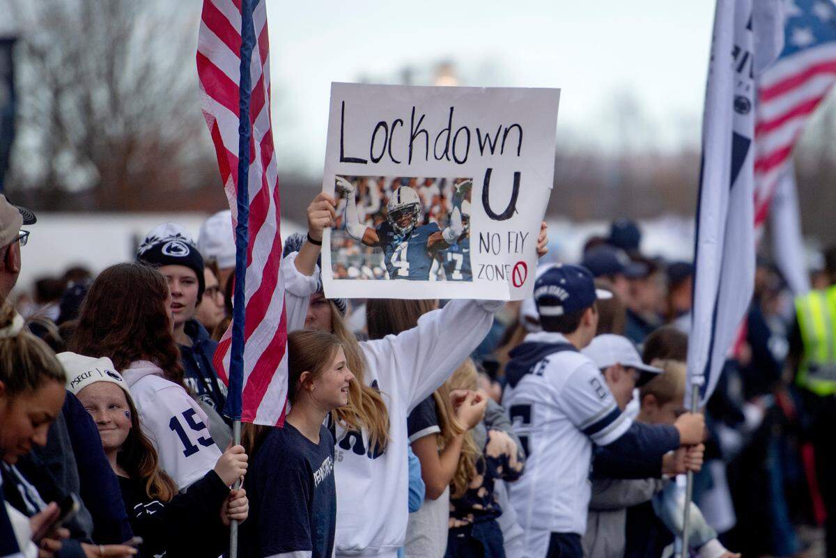 Penn State football fans greet the team as they arrive at Beaver Stadium for the game against Maryland on Saturday, Nov. 12, 2022.