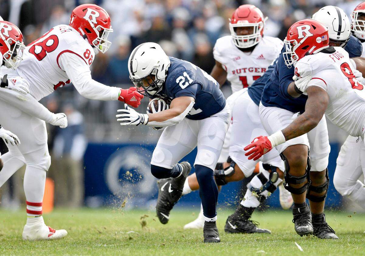 Rutgers defenders try to stop Penn State running back Noah Cain during the game on Saturday, Nov. 20, 2021.