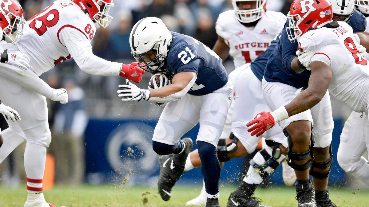 Rutgers defenders try to stop Penn State running back Noah Cain during the game on Saturday, Nov. 20, 2021.