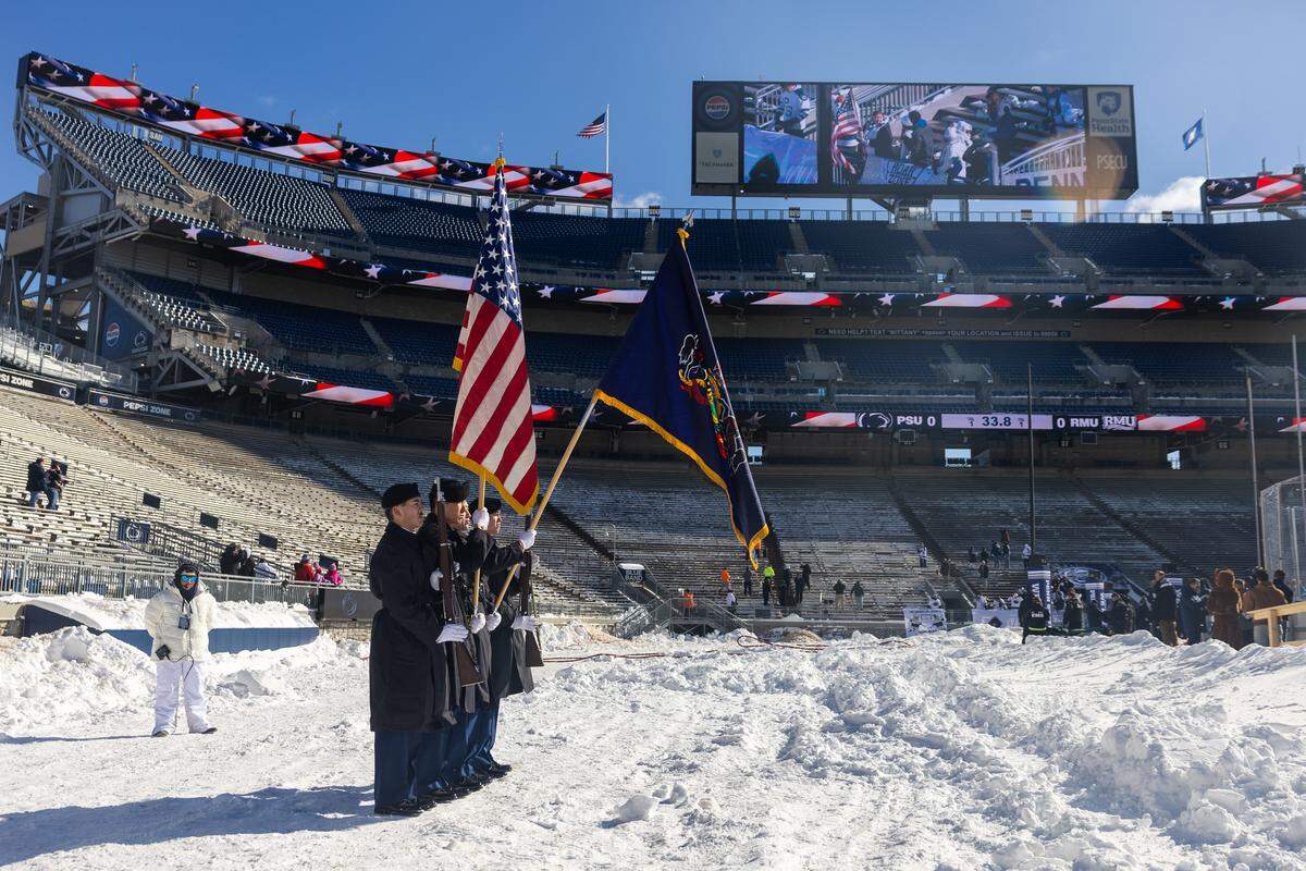 The color guard stands on the eastern side of the rink during the national anthem before the Penn State women’s hockey game at Beaver Stadium on Friday, Jan. 30, 2026, in State College.