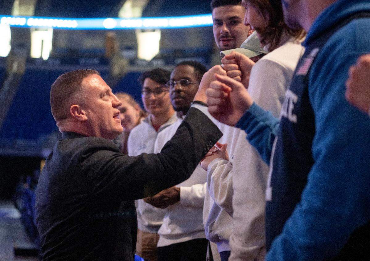 Penn State’s new men’s basketball coach Mike Rhoades greets students from the Legion of Blue after his introductory press conference on Thursday, March 30, 2023.