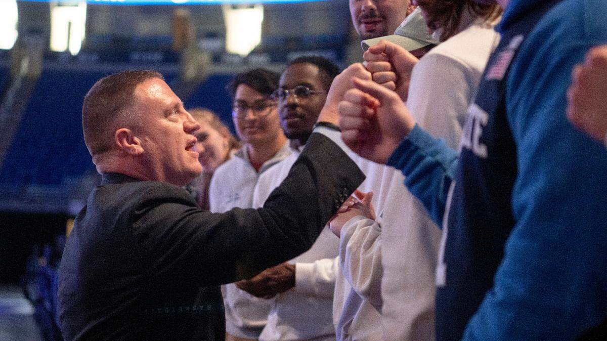 Penn State’s new men’s basketball coach Mike Rhoades greets students from the Legion of Blue after his introductory press conference on Thursday, March 30, 2023.