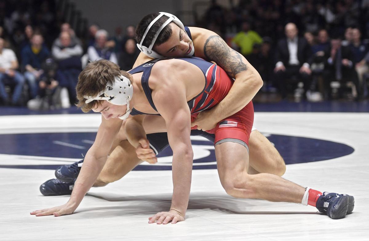 Penn State’s Luke Gardner pull Penn’s Lucas Revano in during the 149 lb bout during the match on Sunday, Dec. 8, 2019. Gardner won by decision, 7-6.