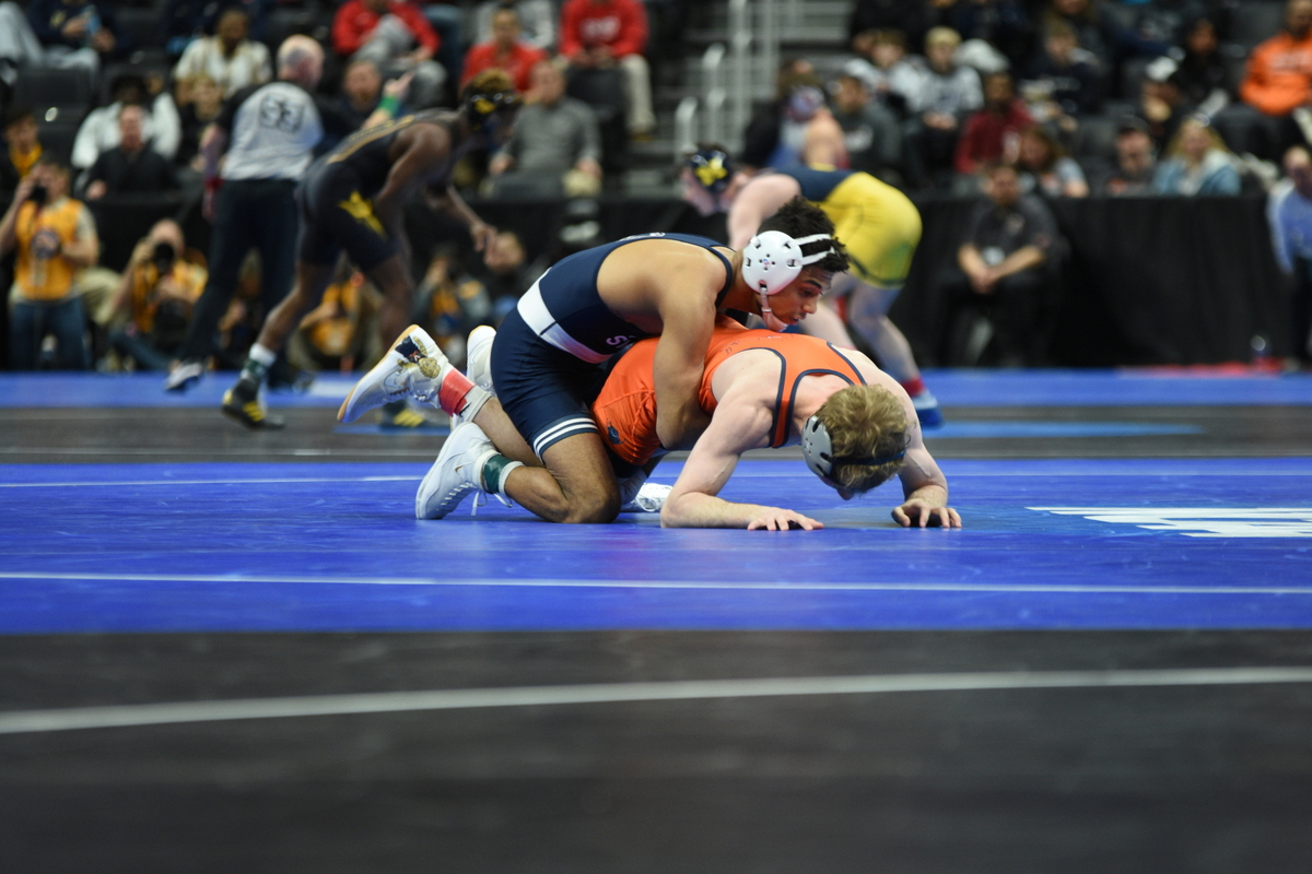 Penn State’s Roman Bravo-Young controls Virginia’s Brian Courtney in their 133-pound quarterfinals match of the NCAA Championships on Friday, March 18, 2022 at Little Caesars Arena in Detroit. Bravo-Young beat Courtney, 13-6.