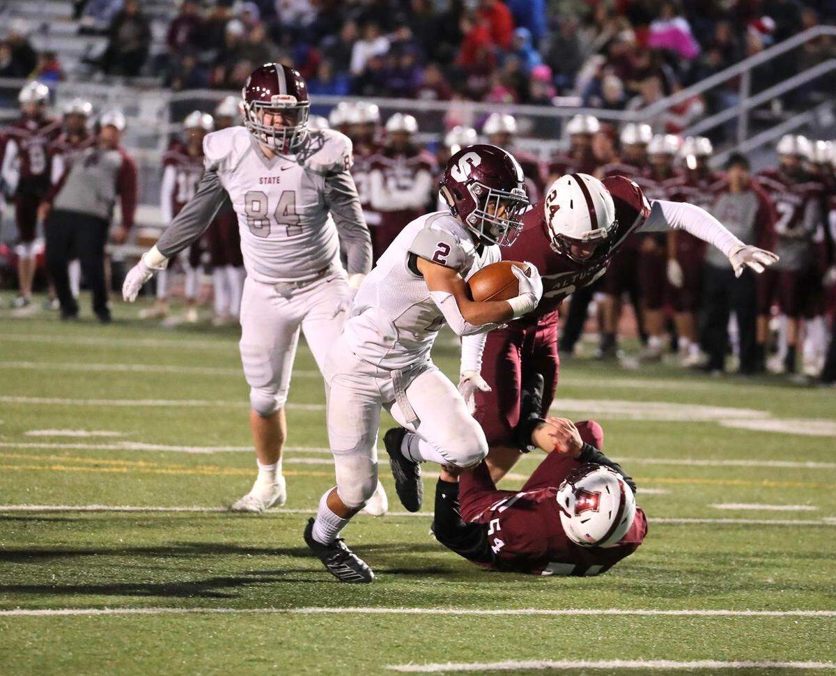 State College’s Dresyn Green (2) had two rushing touchdowns and a pick-6 against Altoona on Friday.