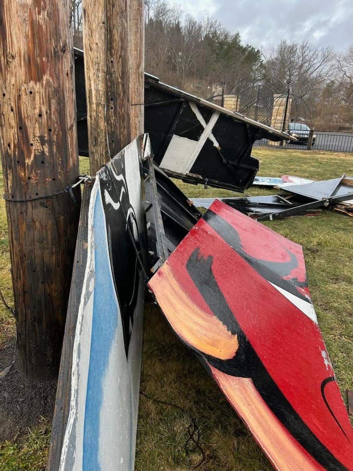 Pieces of the large Santa Claus display on the ground following its collapse.