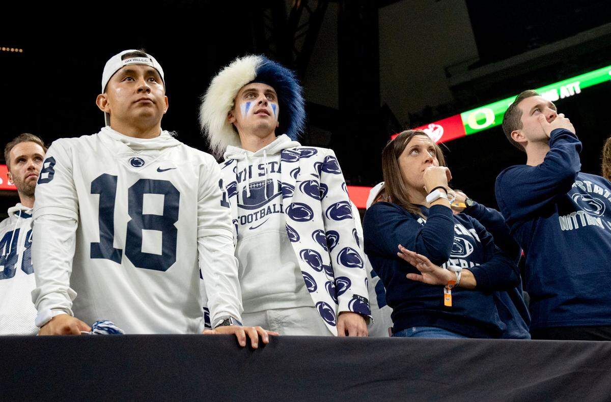 Penn State fans watch in disappointment during the Big Ten Championship game against Oregon at Lucas Oil Stadium on Saturday, Dec. 7, 2024.