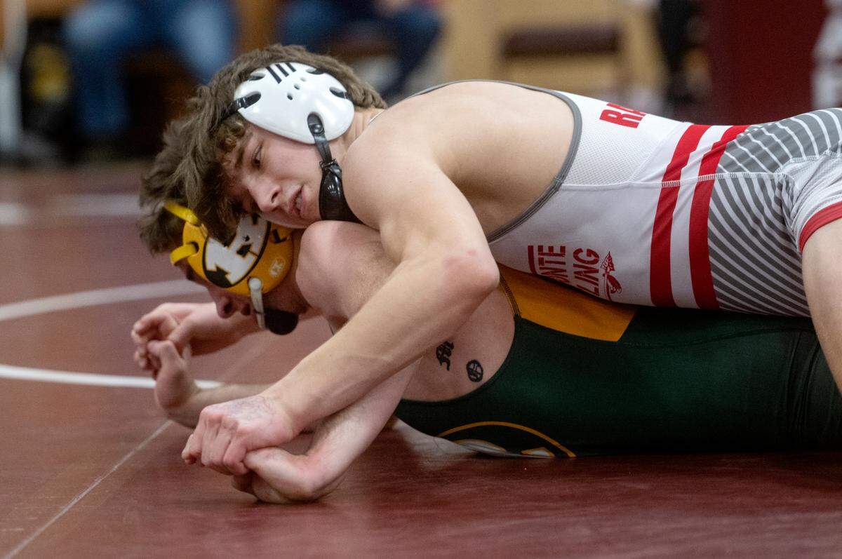 Bellefonte’s Gage Long controls Dustin Flinn in the 145 lb third place bout of the District 6 2A championships on Saturday, Feb. 18, 2023.