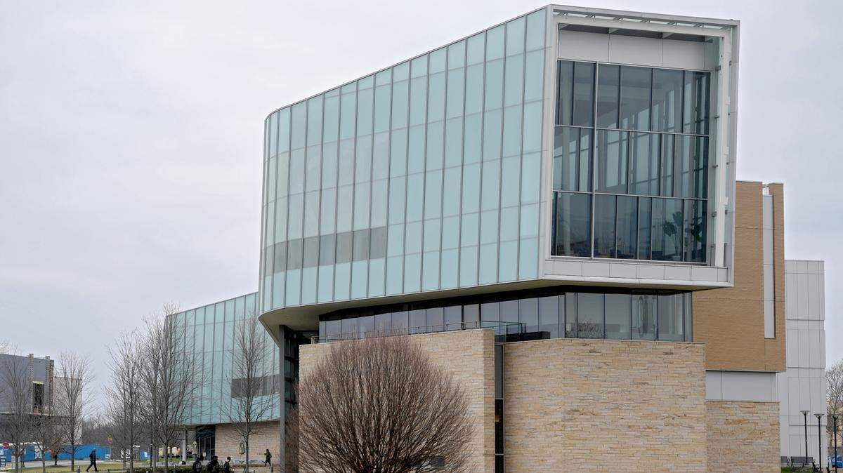 Students enter the Lewis Katz Building, which is home to Penn State Law, on the University Park campus on Tuesday.