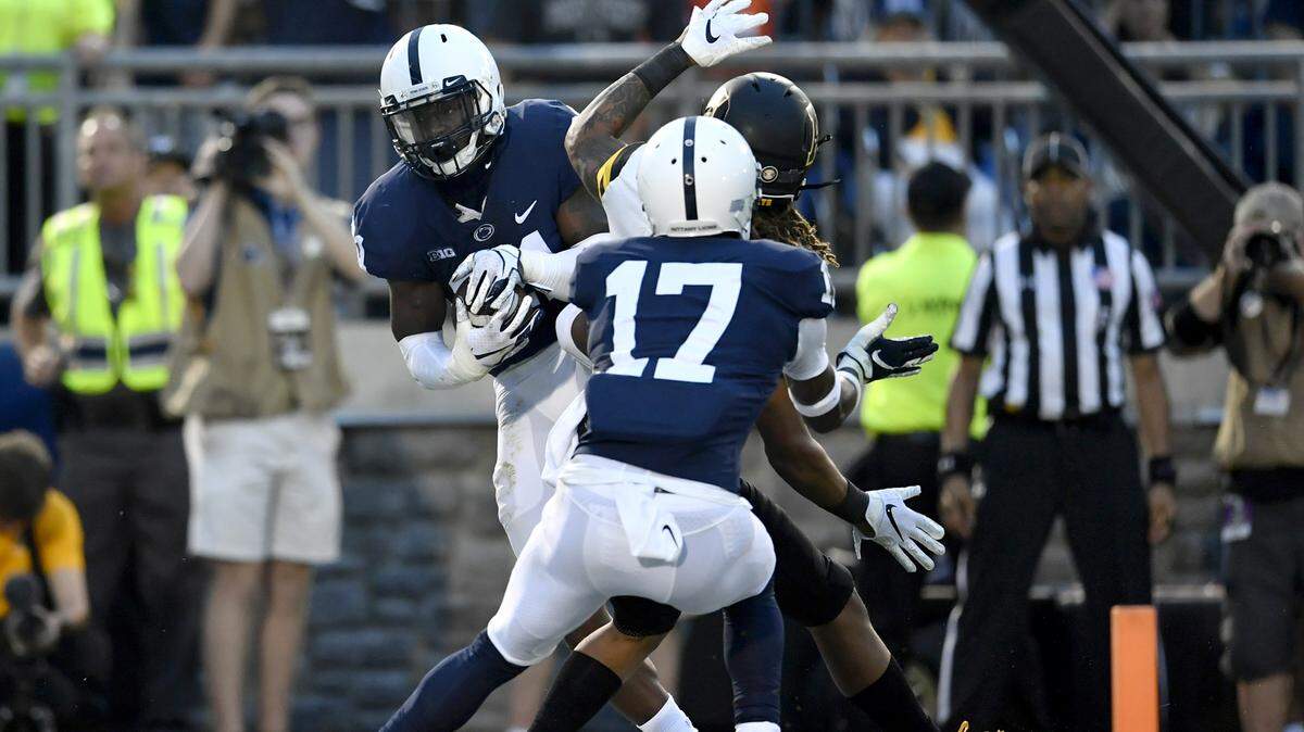 Penn State cornerback Amani Oruwariye intercepts the ball meant Appalachian State wide receiver Corey Sutton for the Nittany Lions to win in overtime of for the Saturday, Sept. 1, 2018 game at Beaver Stadium. 