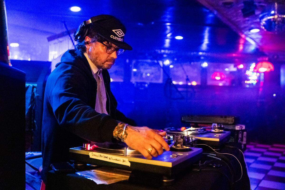 Corey Elbin, the owner of Manny’s Live Performance Space, DJs with vinyl records before a show inside Manny’s Live Performance Space in State College on Thursday, April 1, 2026.