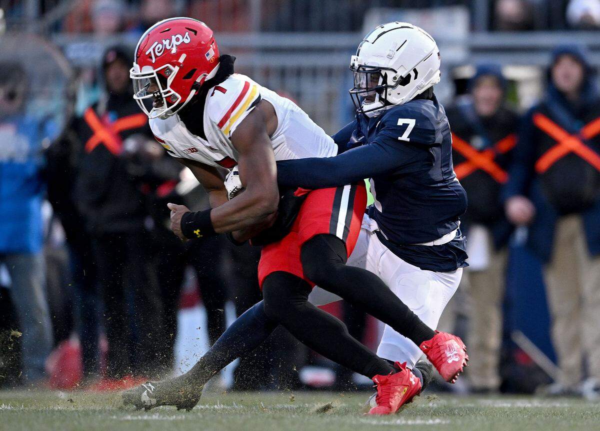 Penn State cornerback Zion Tracy stop Maryland’s quarterback MJ Morris during the game on Saturday, Nov. 30, 2024.  