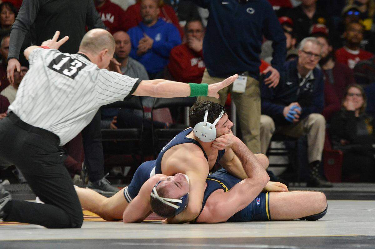 Penn State’s Vincenzo Joseph has Michigan’s Logan Massa in a tight headlock as he turns him to his back for the pin in the semifinal round of the 2019 Big Ten Wrestling Championships on Saturday in Williams Arena in Minneapolis.