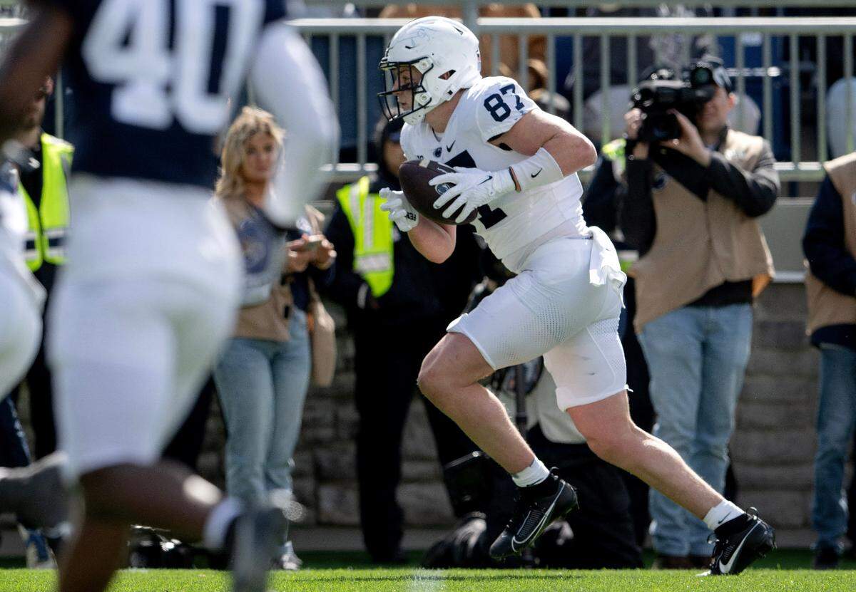 Penn State tight end Andrew Rappleyea makes a catch and runs it in for a touchdown during the Blue-White game on Saturday, April 13, 2024.  