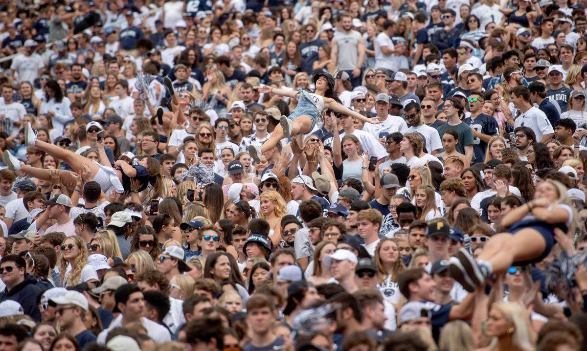 Penn State students are tossed in the air as they celebrate a touchdown during the game against Ohio on Saturday, Sept. 10, 2022.