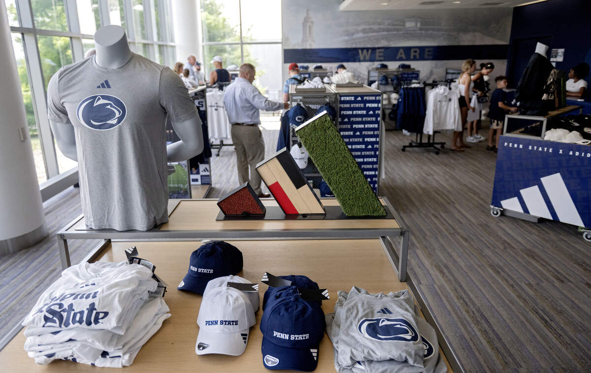 Shoppers browse the new adidas Penn State gear during a pop-up sale on Wednesday, July 1, 2026 at Pegula Ice Arena.