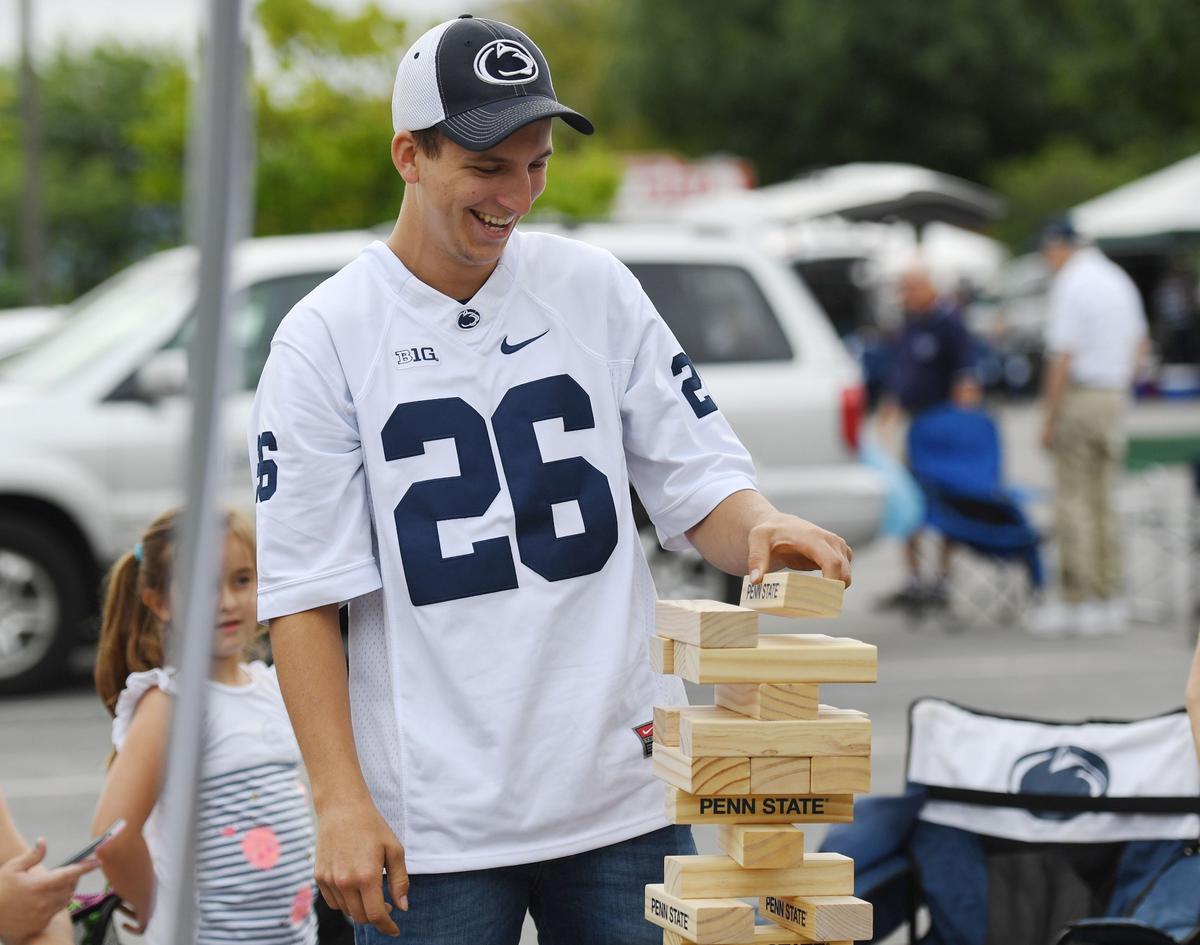 Andrew Atherton plays a game of Jenga before the Penn State vs. Kent State game Saturday, Sept. 15, 2018 at Beaver Stadium.